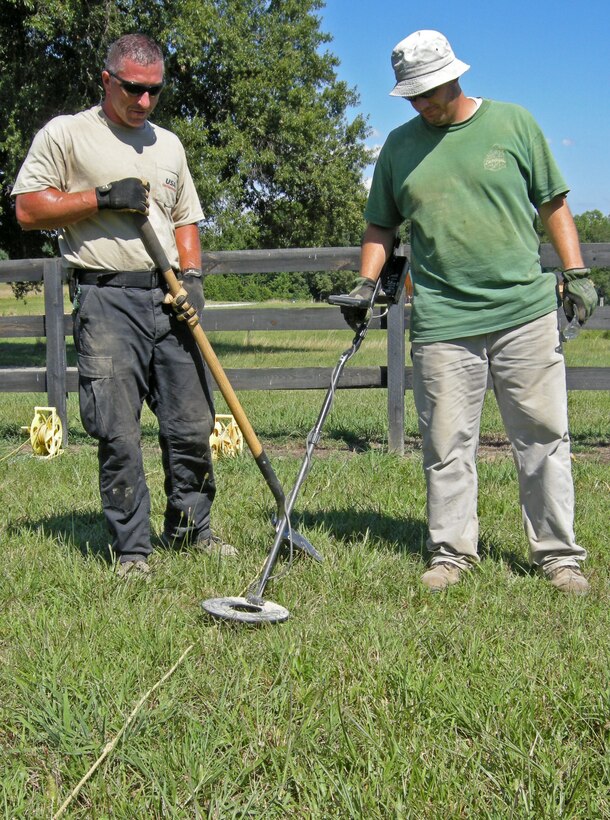 Contract ordnance experts search for unexploded ordnance or UXO near a home located on the Formerly Used Defense Site (FUDS) near Butner, North Carolina. The former Camp Butner was a WWII infantry training area built 30 miles north of Raleigh in 1942. For more information about the FUDS program go to the following link; http://www.usace.army.mil/Missions/Environmental/FormerlyUsedDefenseSites.aspx