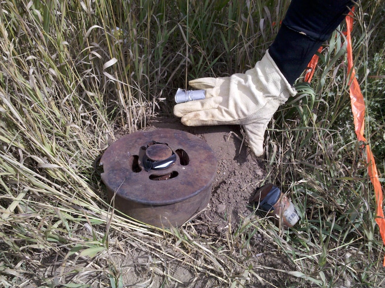 Letting experts handle munitions for proper disposal. A landmine was located during the remedial investigation field work. The landmine was properly disposed of by detonation within the field by USACE contractors. 
 