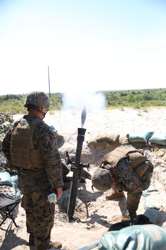 Marine mortarmen with Weapons Company, 1st Battalion, 24th Marine Regiment fire nine rounds for effect at simulated targets down range as part of an indirect-fire weapons integration exercise Aug. 15, 2014 aboard Camp Lejeune, N.C., during exercise Heavy Metal 14. The 81mm mortar is an indirect-fire weapon that allows friendly units to suppress the enemy so they can advance.