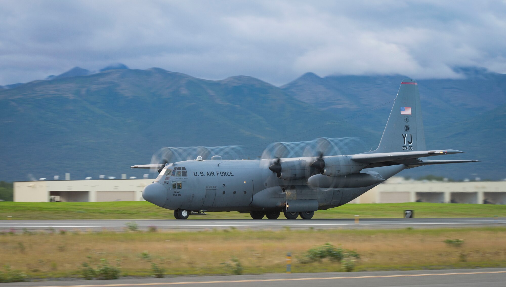 A C-130 Hercules from the 36th Airlift Squadron takes off during Exercise RED FLAG-Alaska on Aug. 19, 2014 at Joint Base Elmendorf-Richardson, Alaska. The aircraft performed a cargo drop mission in support of the exercise. (U.S. Air Force photo by Staff Sgt. Chad C. Strohmeyer/Released)