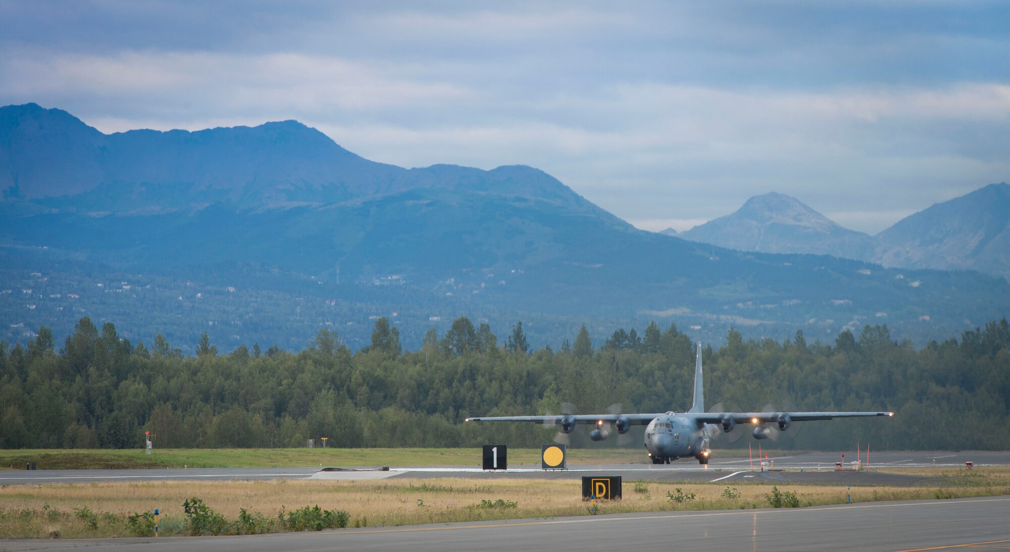 A C-130 Hercules from the 36th Airlift Squadron communicates with the air traffic control tower prior to take off during Exercise RED FLAG-Alaska on Aug. 19, 2014 at Joint Base Elmendorf-Richardson, Alaska. The aircraft performed a cargo drop mission in support of the exercise. (U.S. Air Force photo by Staff Sgt. Chad C. Strohmeyer/Released)