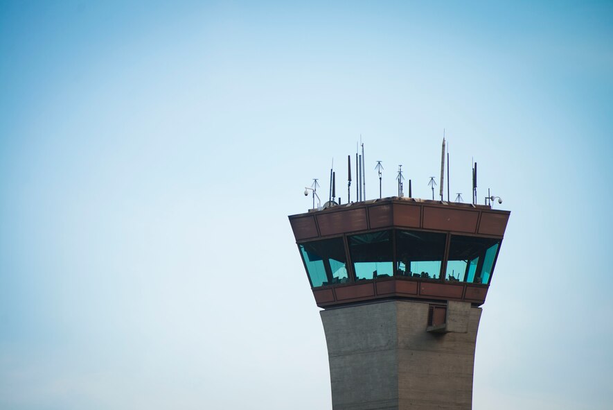 Air traffic controllers guide aircraft from the tower during Exercise RED FLAG-Alaska on Aug. 19, 2014 at Joint Base Elmendorf-Richardson, Alaska. The controllers communicated with more than seven types of aircraft on two runways during the exercise. (U.S. Air Force photo by Staff Sgt. Chad C. Strohmeyer/Released)