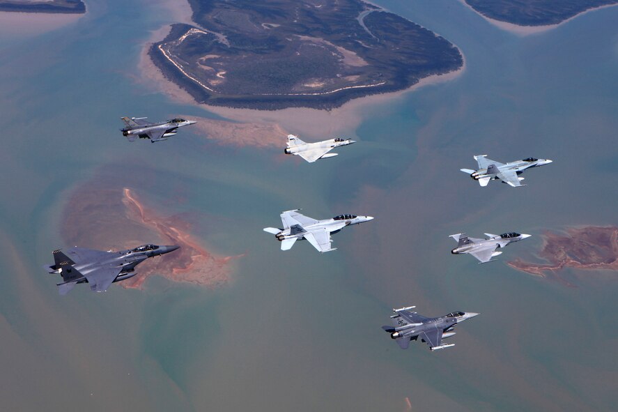 An F-16 Fighting Falcon aircraft from the D.C. Air National Guard performs an air-to-air formation with aircraft from the Royal Thai, United Arab Emirates, Republic of Singapore and Royal Australian air forces during Pitch Black 2014. The ANG unit is deployed to Australia from Kunsan Air Base, Republic of Korea. Pitch Black is the RAAF’s largest and most complex air exercise, traditionally held in the Northern Territory every two years. Exercise Pitch Black is being conducted from RAAF Bases Darwin and Tindal Aug. 1 through 22, 2014, featuring participants from Australia, the United States, New Zealand, Singapore, Thailand, United Arab Emirates and French Air Force (New Caledonia) who will cooperate for Offensive Counter Air (OCA) and Defensive Counter Air (DCA) missions. (Royal Australian Air Force photo by Cpl. David Gibbs/Released)
