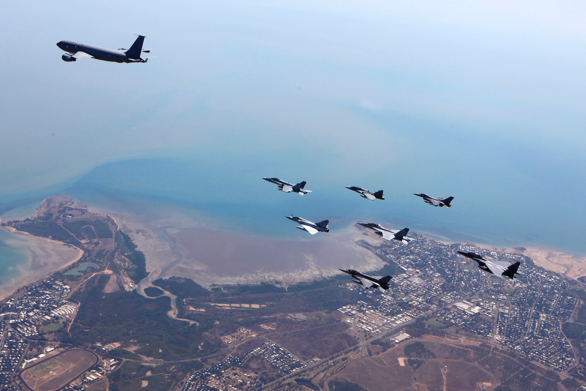 An F-16 Fighting Falcon aircraft from the D.C. Air National Guard performs an air-to-air formation with aircraft from the Royal Thai, United Arab Emirates, Republic of Singapore and Royal Australian air forces during Pitch Black 2014. The ANG unit is deployed to Australia from Kunsan Air Base, Republic of Korea. Pitch Black is the RAAF’s largest and most complex air exercise, traditionally held in the Northern Territory every two years. Exercise Pitch Black is being conducted from RAAF Bases Darwin and Tindal Aug. 1 through 22, 2014, featuring participants from Australia, the United States, New Zealand, Singapore, Thailand, United Arab Emirates and French Air Force (New Caledonia) who will cooperate for Offensive Counter Air (OCA) and Defensive Counter Air (DCA) missions. (Royal Australian Air Force photo by Cpl. David Gibbs/Released)
