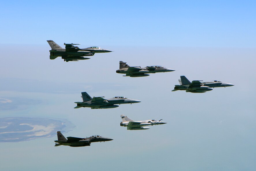 An F-16 Fighting Falcon aircraft from the D.C. Air National Guard performs an air-to-air formation with aircraft from the Royal Thai, United Arab Emirates, Republic of Singapore and Royal Australian air forces during Pitch Black 2014. The ANG unit is deployed to Australia from Kunsan Air Base, Republic of Korea. Pitch Black is the RAAF’s largest and most complex air exercise, traditionally held in the Northern Territory every two years. Exercise Pitch Black is being conducted from RAAF Bases Darwin and Tindal Aug. 1 through 22, 2014, featuring participants from Australia, the United States, New Zealand, Singapore, Thailand, United Arab Emirates and French Air Force (New Caledonia) who will cooperate for Offensive Counter Air (OCA) and Defensive Counter Air (DCA) missions. (Royal Australian Air Force photo by Cpl. David Gibbs/Released)
