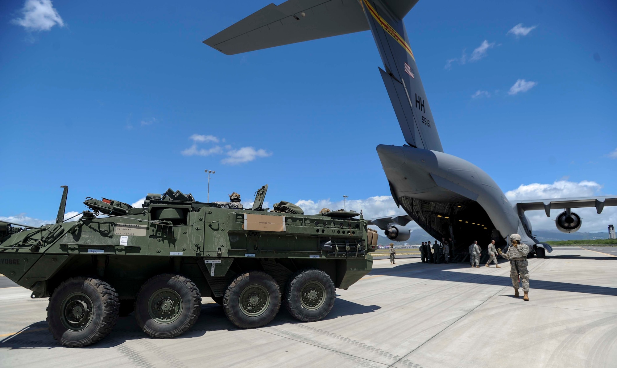 A U.S. Army Stryker combat vehicle is guided into a C-17 Globemaster III from the 535th Airlift Squadron during a 25th Infantry Division training exercise on the Joint Base Pearl Harbor-Hickam, Hawaii, flightline Aug. 13, 2014. The Stryker, the Army’s Interim Armored Vehicle, is used to provide quick response maneuvering capability, enhanced survivability and lethality and expand fight versatility. (U.S. Air Force photo by Tech. Sgt. Terri Paden)