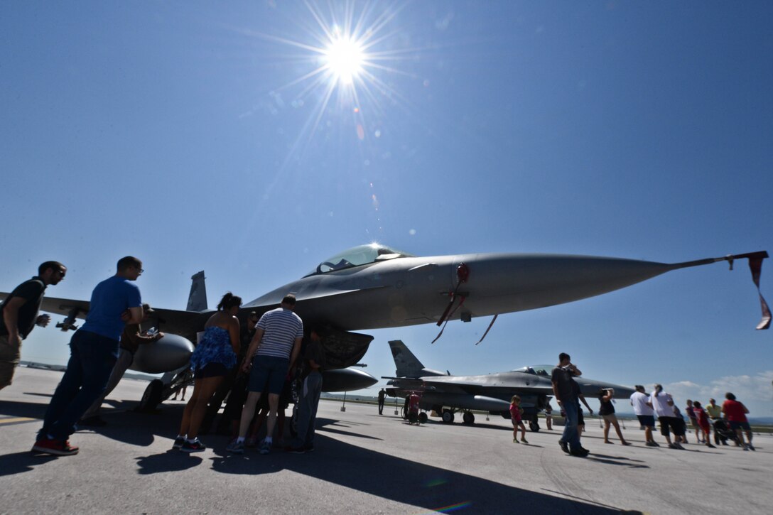 Airmen, family, and community members tour an F-16 Fighting Falcon on the flightline during Ellsworth’s Black Hills Community Appreciation Day at Ellsworth Air Force Base, S.D., Aug. 16, 2014. The event featured multiple static displays, aerial events, food vendors, booths, working dog demonstrations to show appreciation for the continued support from the Black Hills region. (U.S. Air Force photo by Senior Airman Zachary Hada/Released)