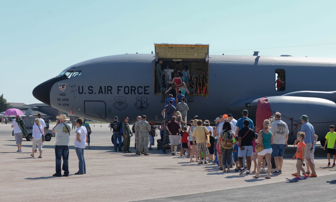 Airmen, family, and community members tour a KC-135 Stratotanker assigned to the 92nd Operations Group, Fairchild Air Force Base, Wash., on the flightline during Ellsworth's Black Hills Community Appreciation Day at Ellsworth Air Force Base, S.D., Aug. 16, 2014. Throughout the day, military and community members alike had the chance to view various aircraft and talk to aircrew about their responsibilities in the Air Force. (U.S. Air Force photo by Senior Airman Zachary Hada/Released)