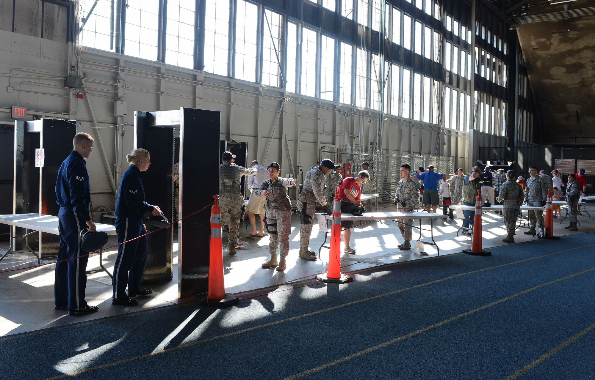 Airmen assigned to the 28th Security Forces Squadron perform security checks at the Pride Hangar during Ellsworth’s Black Hills Community Appreciation Day at Ellsworth Air Force Base, S.D., Aug. 16, 2014. The purpose of the event was to increase the community’s overall understanding of the base mission and Air Force lifestyle and thank them for their support over the years. (U.S. Air Force photo by Senior Airman Zachary Hada/Released)