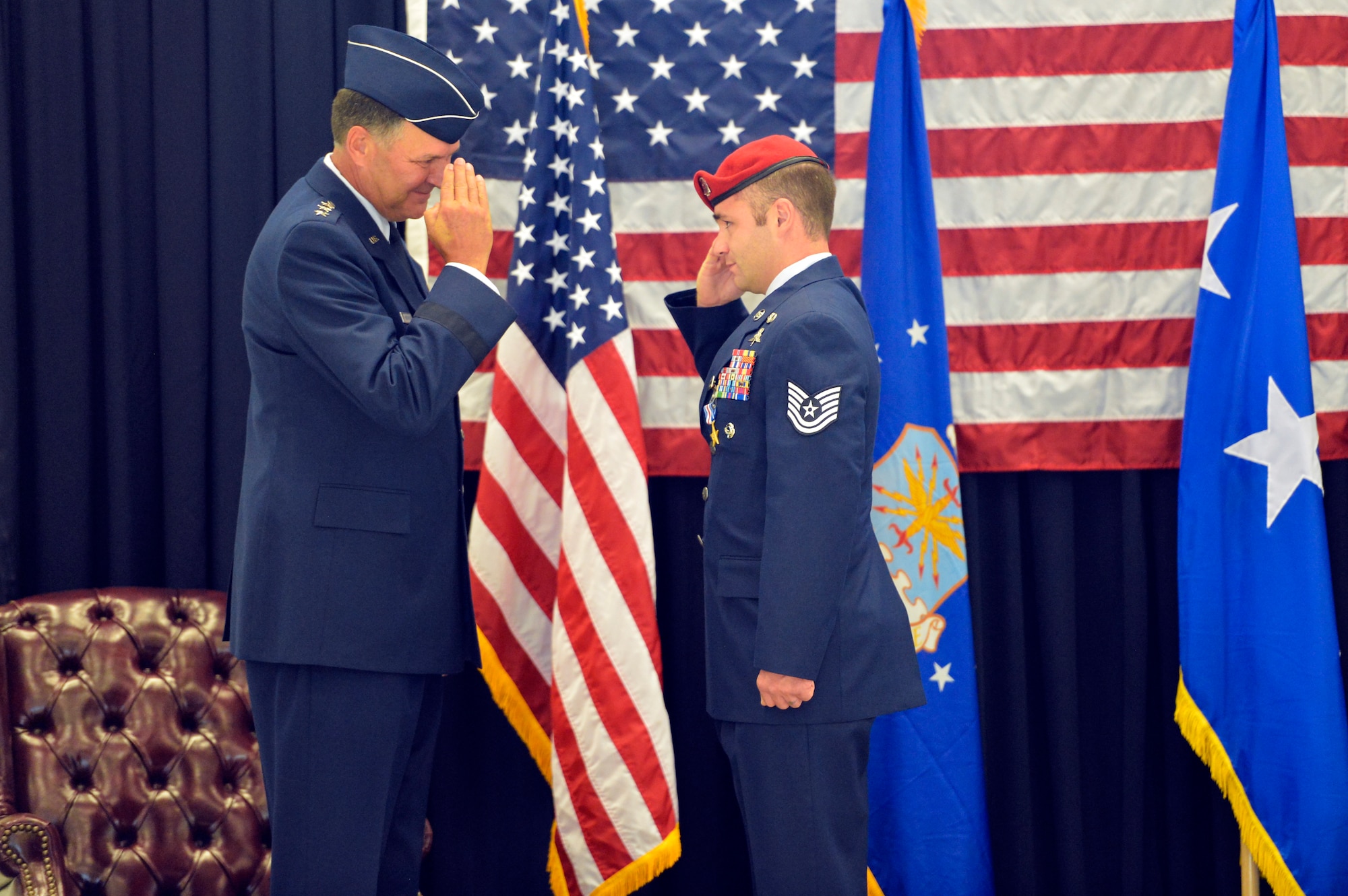 Tech. Sgt. Matthew McKenna (right), 22nd Special Tactics Squadron combat controller salutes Lt. Gen. Bradley Heithold, Air Force Special Operations Command commander Aug. 18, 2014, after being awarded the Silver Star during the 22nd STS awards ceremony at Joint Base Lewis-McChord, Wash. McKenna was the fourth 22nd STS member to earn the medal for operations conducted in Iraq and Afghanistan. (U.S. Air Force photo/Staff Sgt. Russ Jackson)