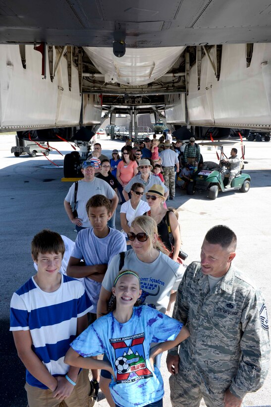 Airmen, their families and the local community line up to step onto a B-1 bomber during Ellsworth’s Black Hills Community Appreciation Day event at Ellsworth Air Force Base, S.D., Aug. 16, 2014. The event was a way of thanking friends and neighbors throughout the area for their support by providing the opportunity to interact with base personnel while also seeing several aircraft and military vehicle static displays, ground acts, food booths and entertainment by Dogs Without Sweaters. (U.S. Air Force photo by Senior Airman Anania Tekurio/Released)