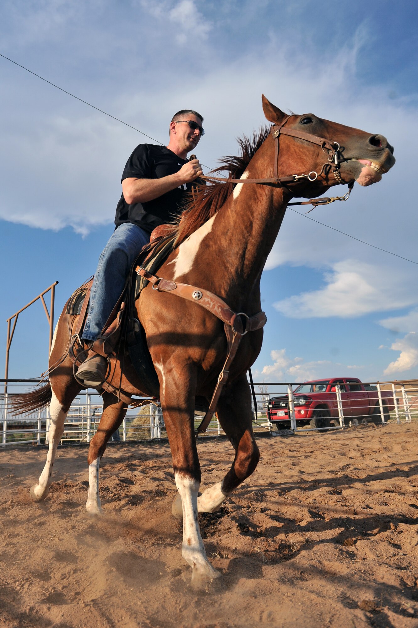 ALTUS, Okla. – U.S. Air Force Col. Bill Spangenthal, 97th Air Mobility Wing commander, trots on a horse during warm-ups for the annual Commander’s Cattle Sorting Competition held at Bull Watkins’ Farm in Altus, Okla., Aug. 17, 2014. The competition allowed base leaders a chance to prepare for the 36th Annual Great Plains Stampede Rodeo. (U.S. Air Force photo by Senior Airman Dillon Davis/Released)