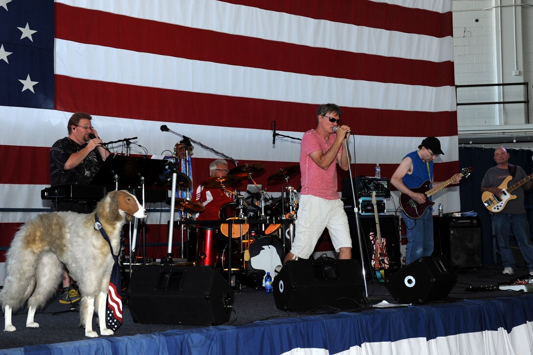 Dogs Without Sweaters, a local band, performs at the Black Hills Community Appreciation Day at Ellsworth Air Force Base, S.D., Aug. 16, 2014. The band performed covers of adult contemporary songs from artists like Journey as entertainment for nearly 3,000 community members who attended the event. (U.S. Air Force photo by Senior Airman Hailey R. Staker) 