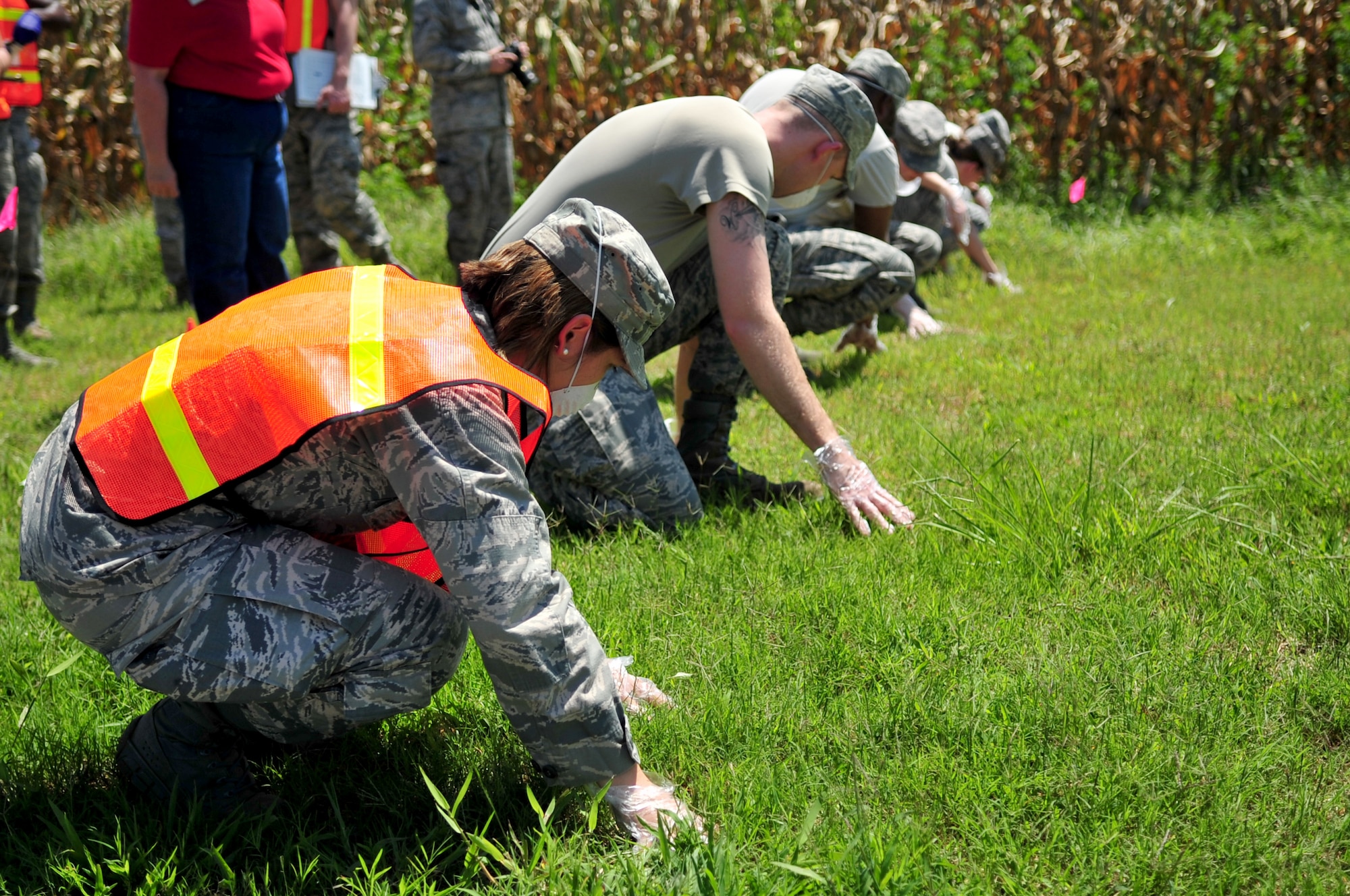 Airmen assigned to the 4th Force Support Squadron crash recovery team perform a grid search during a major accident response exercise Aug. 14, 2014, in Goldsboro, North Carolina. Seymour Johnson Air Force Base partnered with Goldsboro and Wayne County first responders for a two-day exercise designed to test the effectiveness of both the base and local authorities to a military incident in the Goldsboro area.
 (U.S. Air Force photo/Airman 1st Class Shawna Keyes)
