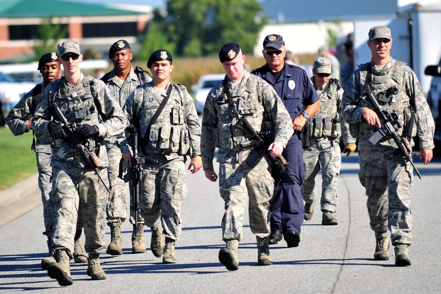 Airmen assigned to the 4th Security Forces Squadron respond to a simulated aircraft crash scene during a major accident response exercise Aug. 14, 2014, in Goldsboro, North Carolina. Seymour Johnson Air Force Base partnered with Goldsboro and Wayne County first responders for a two-day exercise designed to test the effectiveness of both the base and local authorities to a military incident in the Goldsboro area. (U.S. Air Force photo/Airman 1st Class Shawna Keyes)