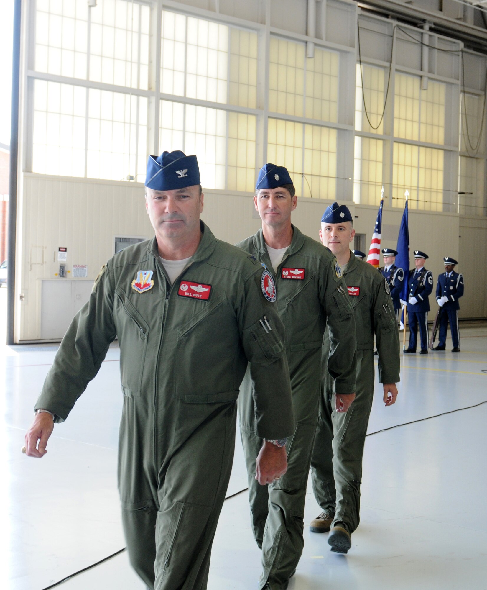 Col. William J. Butz, 192nd Operations Group commander, presents the squadron colors to Lt. Col. Micah Fesler, signifying the transfer of command of the 149th Fighter Squadron, during a change of command ceremony held July 12, 2014 at Joint Base Langley-Eustis. (U.S. Air National Guard photo by 2nd Lt. Meaghan E. M. Selki/Released)