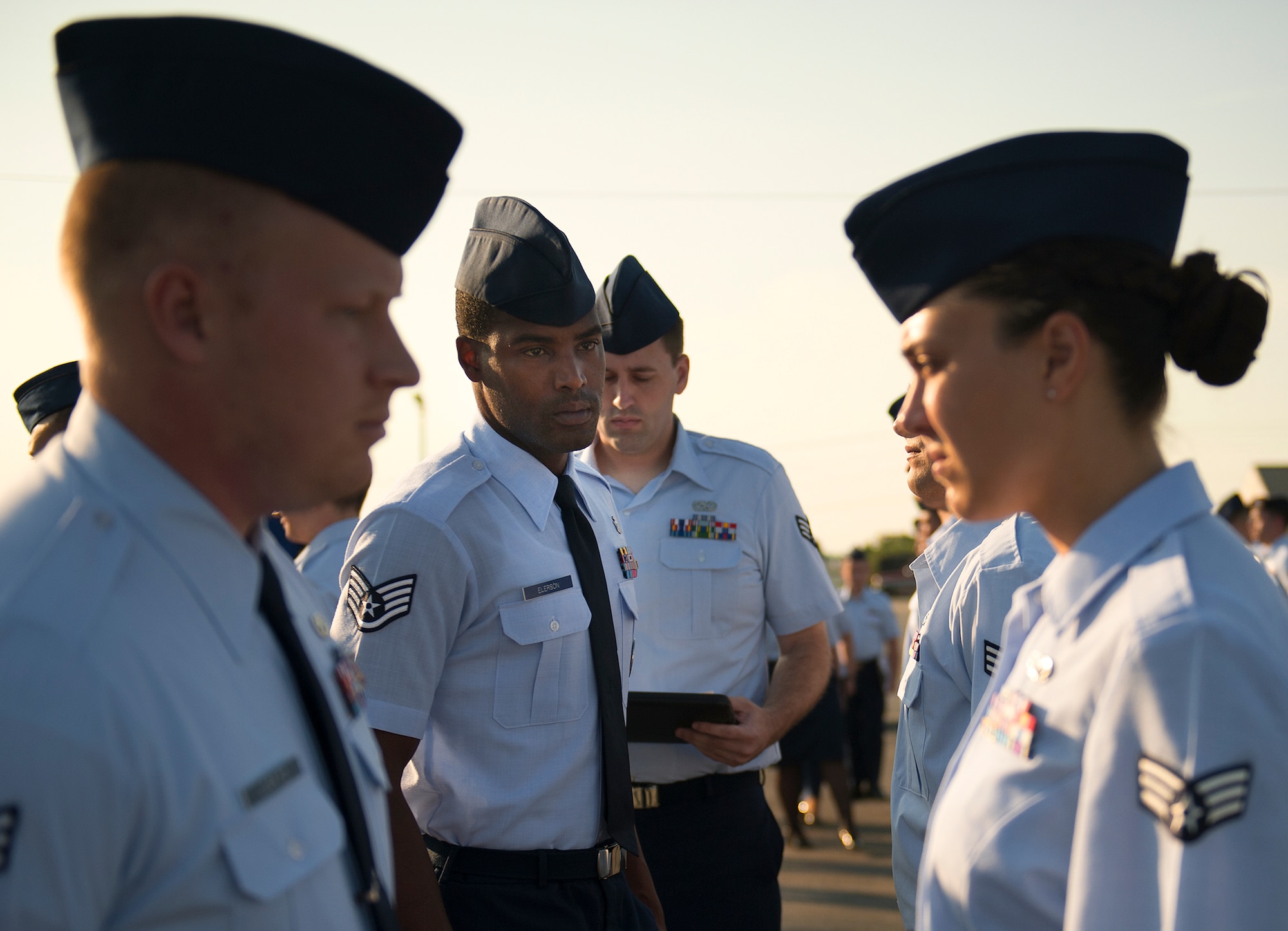 Staff Sgt. Adam Elerson, Eglin Airman Leadership School instructor, scrutinizes his flight during an open ranks inspection Aug. 14.   Each week, ALS instructors look for anything out of place during the open ranks inspection process to include loose strings, improper wear of uniform items and overall appearance of the Airmen’s uniform. (Air Force photo/Tech. Sgt. Jasmin Taylor)