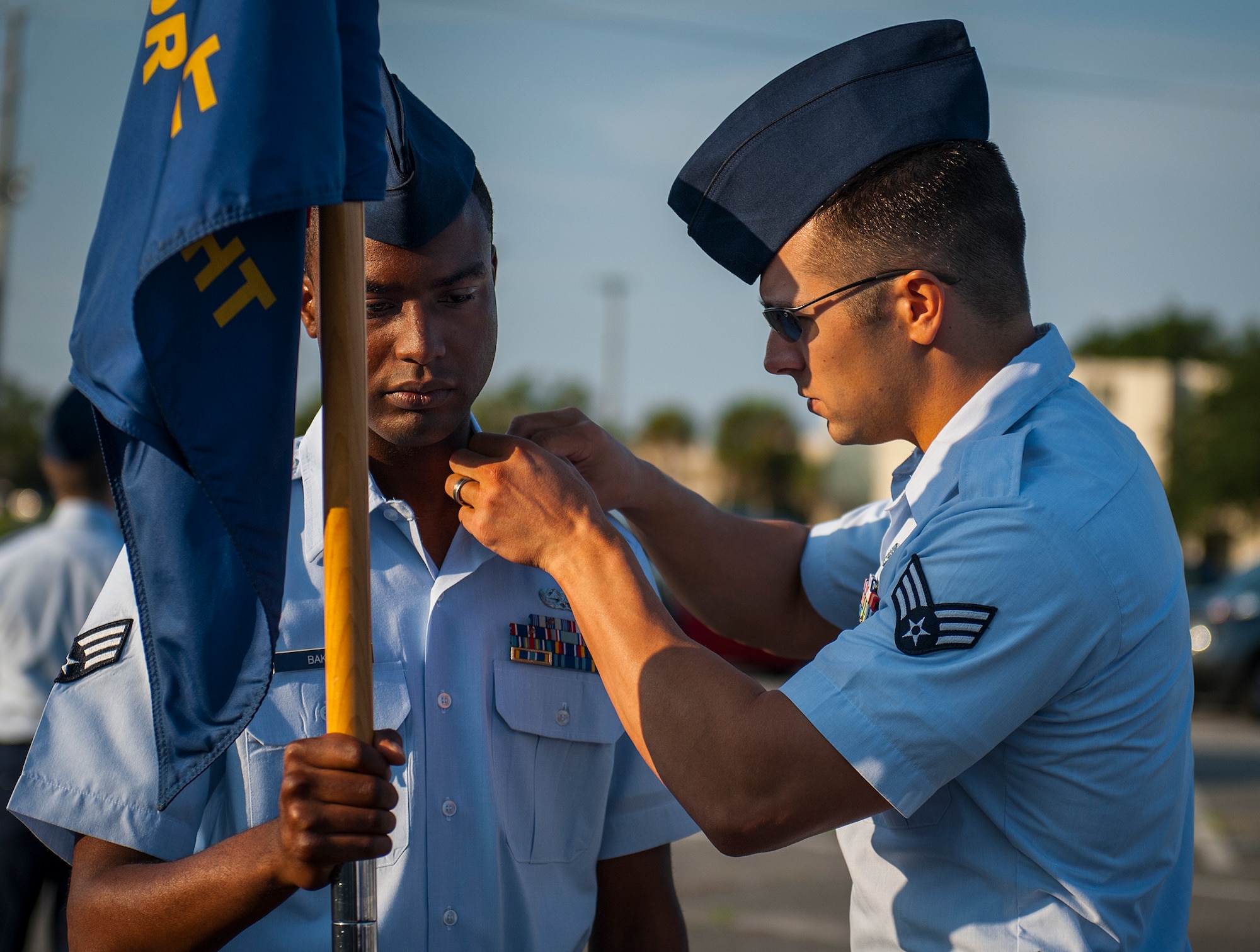 An Airman inspects another’s uniform before Airman Leadership School instructors conduct an open ranks inspection Aug. 14 at Eglin Air Force Base, Fla.  Each week, ALS instructors look for anything out of place during the open ranks inspection process to include loose strings, improper wear of uniform items and overall appearance of the Airmen’s uniform. (Air Force photo/Tech. Sgt. Jasmin Taylor)