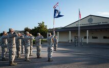 Airmen salute the flag during reveille at the Eglin Professional Development Center Aug. 14. The current class graduates Aug. 26 from Airman Leadership School as part of their month-long path to becoming a non-commissioned officer. Roughly every two to three weeks ALS begins a new class, averaging seven classes a year. (U.S. Air Force photo/ Tech. Sgt. Jasmin Taylor)