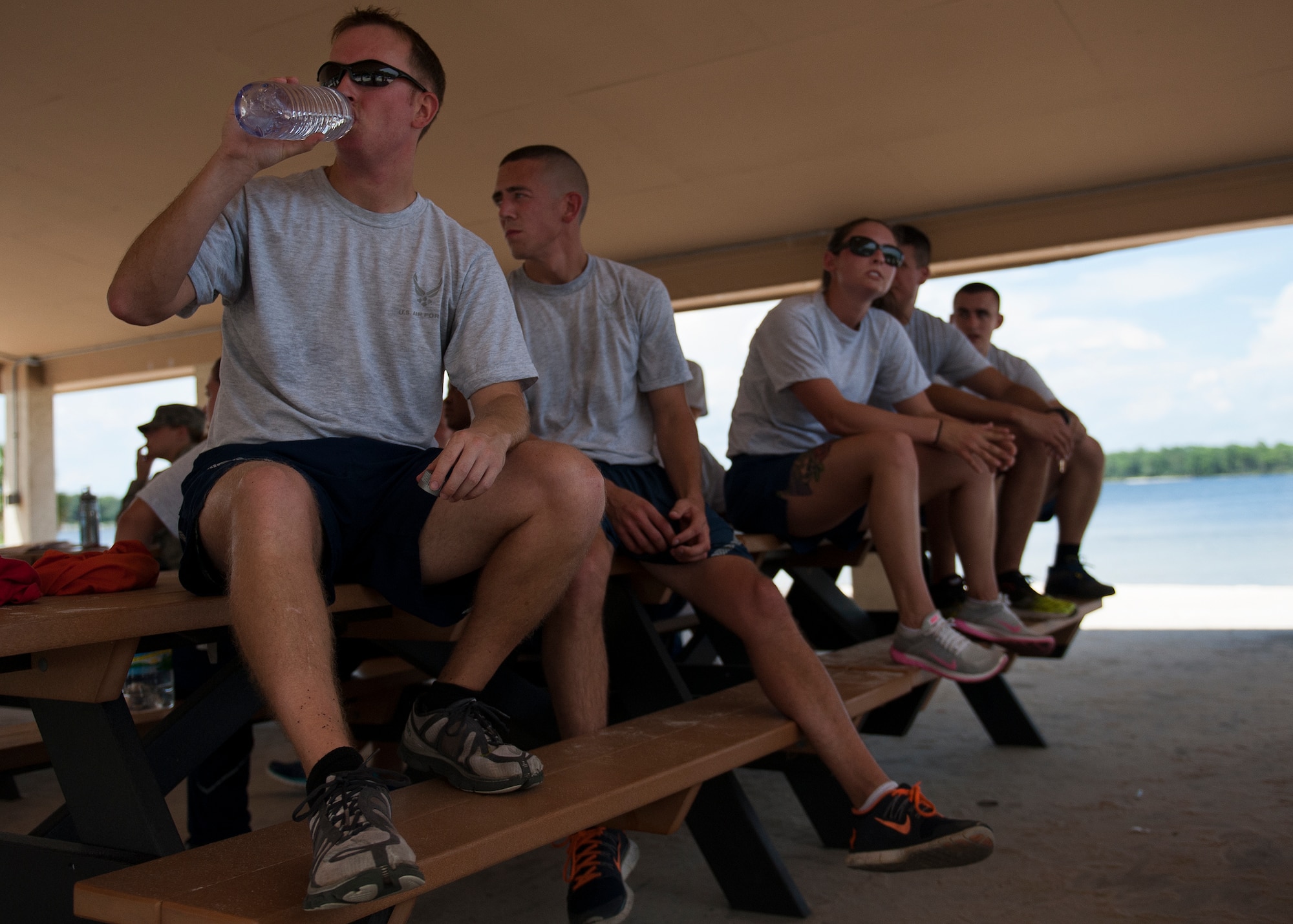 Airmen take a break after completing their mission during a joint warfare exercise at Eglin’s Post’l Point Aug. 12.  The exercise is designed to develop joint warfighter knowledge while challenging the Airmen physically and applying teamwork as a flight.  It is part of the curriculum of Eglin’s Airman Leadership School.  (U.S. Air Force photo/ Tech. Sgt. Jasmin Taylor)