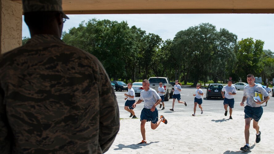 Florida sun breaks on the faces of Airman Leadership School students as instructors complete their open ranks inspection Aug. 14 at Eglin Air Force Base, Fla. ALS instruction covers roles and responsibilities of non-commissioned officers, dress and appearance, drill and community service.  The current class graduates Aug. 26.  (Air Force photo/Tech. Sgt. Jasmin Taylor)