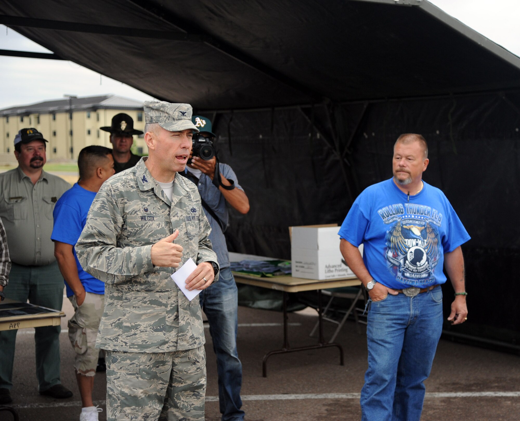 Col. Tom Wilcox, 341st Missile Wing commander, kicks off the 2014 Rolling Thunder motorcycle safety event with a speech to the riders at Malmstrom Air Force Base, Mont. Aug. 14. “This event is really designed for safety,” Wilcox said. “It’s where we can get all of the motorcycle riders, who want to participate across the base, together for a day of fellowship and safety awareness.” (U.S. Air Force photo/Airman 1st Class Joshua Smoot)