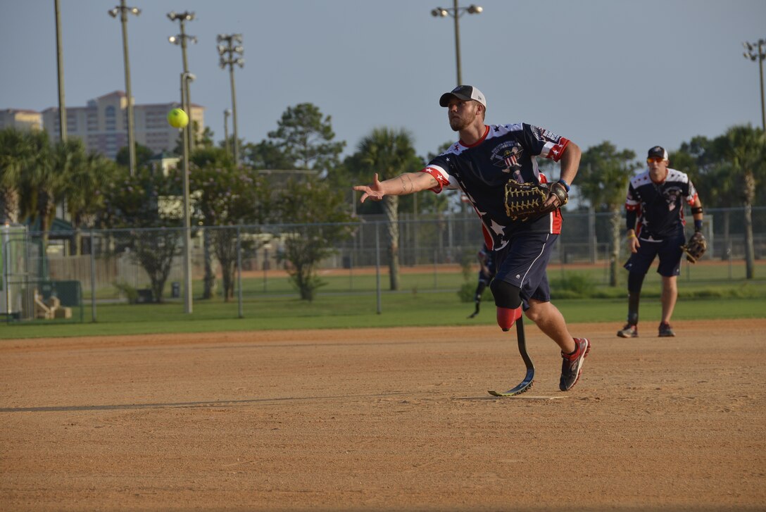 Carter Hess, Wounded Warrior Amputee Softball Team pitcher, plays in the 2014 United States Specialty Sports Association Military World Softball Tournament August 14 at Frank Brown Park. The four-day event featured 92 military slow-pitch teams from U.S. military services around the world. (U.S. Photo by Master Sgt. Kurt Skoglund/Released)