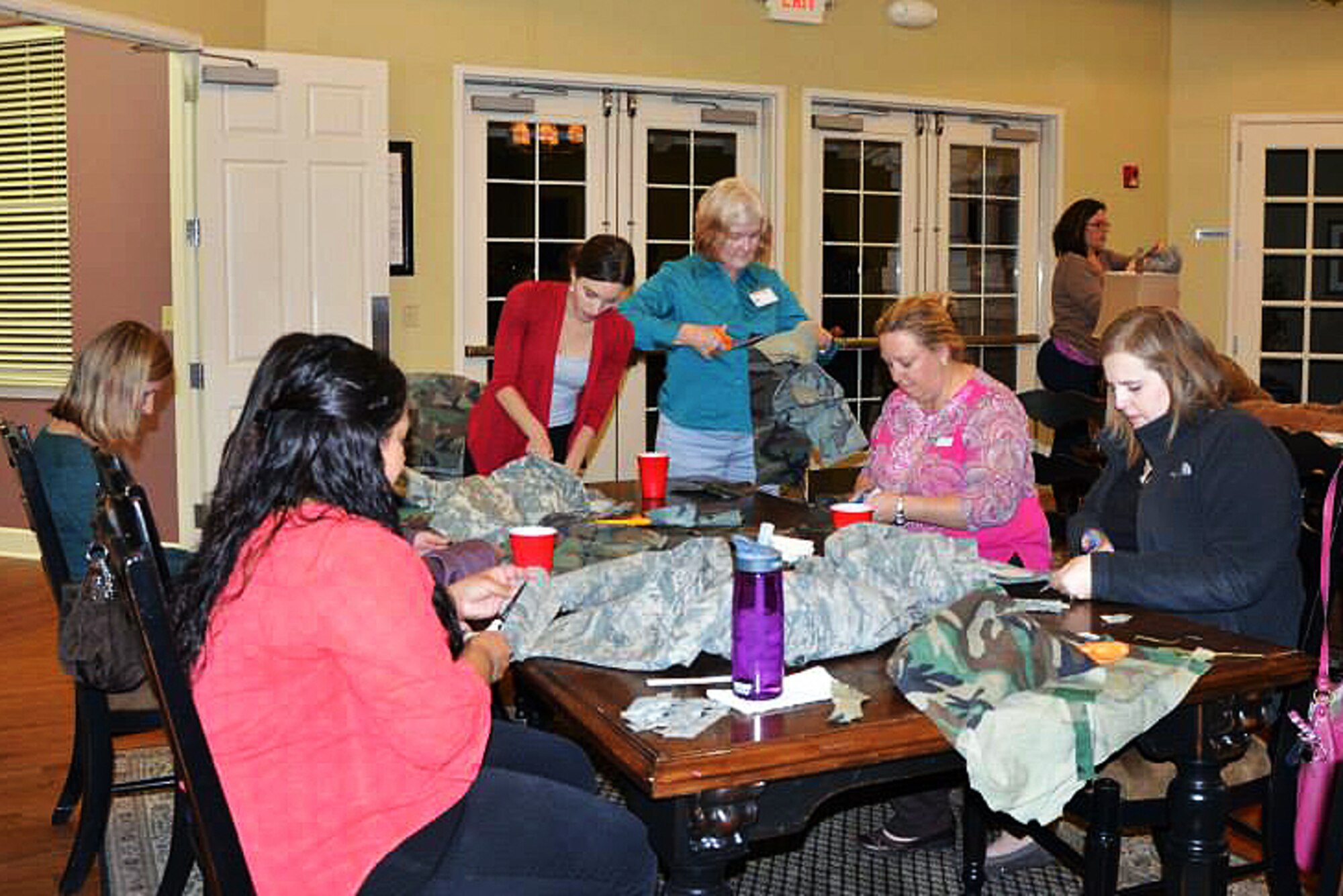 Buckley Spouses Group members participate in a Uniform Wreaths for Veterans Home event Nov. 19, 2013, at the base housing office on Buckley Air Force Base, Colo. The group works to unite servicemembers’ spouses, provide support to others when needed, and plan and host events for all family members to attend. (Courtesy Photo/Released)