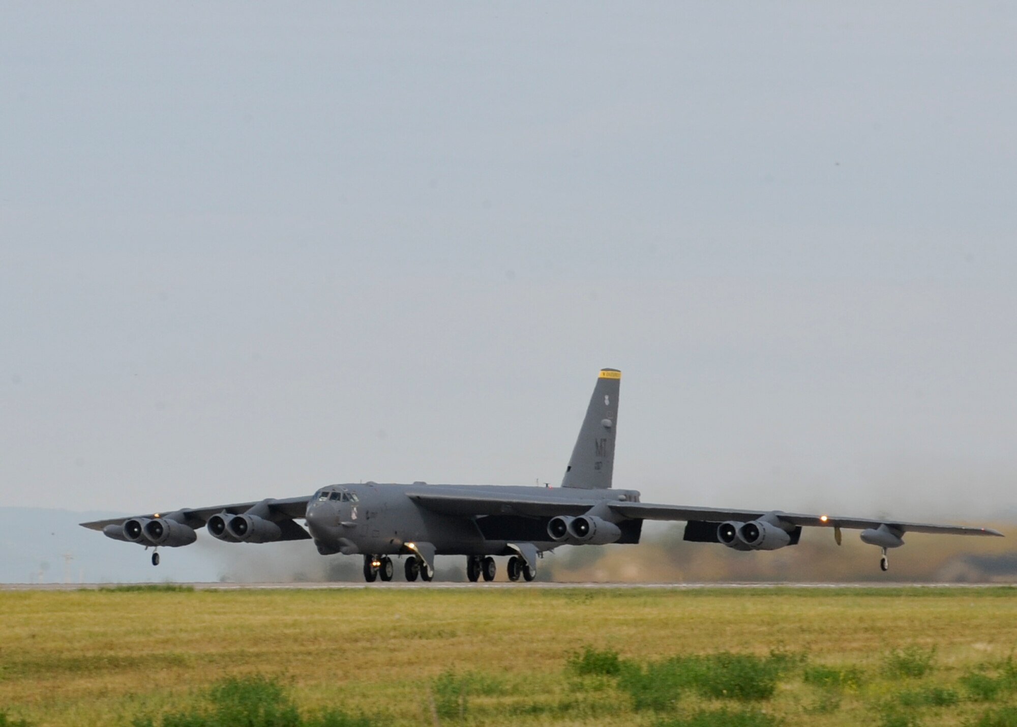 A B-52 Stratofortress from Minot Air Force Base, N.D., takes off during a standoff weapons integration training exercise at Ellsworth AFB, S.D., Aug. 14, 2014. The week-long training consists of B-52s and B-1s conducting simulated combat scenarios at the Powder River Training area to help prepare for real world contingencies. (U.S. Air Force photo by Senior Airman Anania Tekurio/Released)