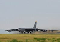 A B-52 Stratofortress from Minot Air Force Base, N.D., takes off during a standoff weapons integration training exercise at Ellsworth AFB, S.D., Aug. 14, 2014. The week-long training consists of B-52s and B-1s conducting simulated combat scenarios at the Powder River Training area to help prepare for real world contingencies. (U.S. Air Force photo by Senior Airman Anania Tekurio/Released)