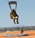 A pararescueman from the 306th Rescue Squadron lands at a drop zone during a HALO (High Altitude Low Opening) jump training exercises. The 306th Rescue Squadron is an Air Force Reserve unit assigned to the 943rd Rescue Group at Davis-Monthan Air Force Base, Ariz. The 306th RQS is a pararescue squadron that trains to maintain the capability to perform day or night rescue missions in any adverse weather conditions and their motto is 