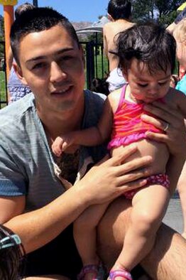 Cpl. Mauricio Sandoval, Bulk Fuel Company Charlie NCO in charge of administration, holds his daughter, Yaretzy, 1. (Courtesy photo)