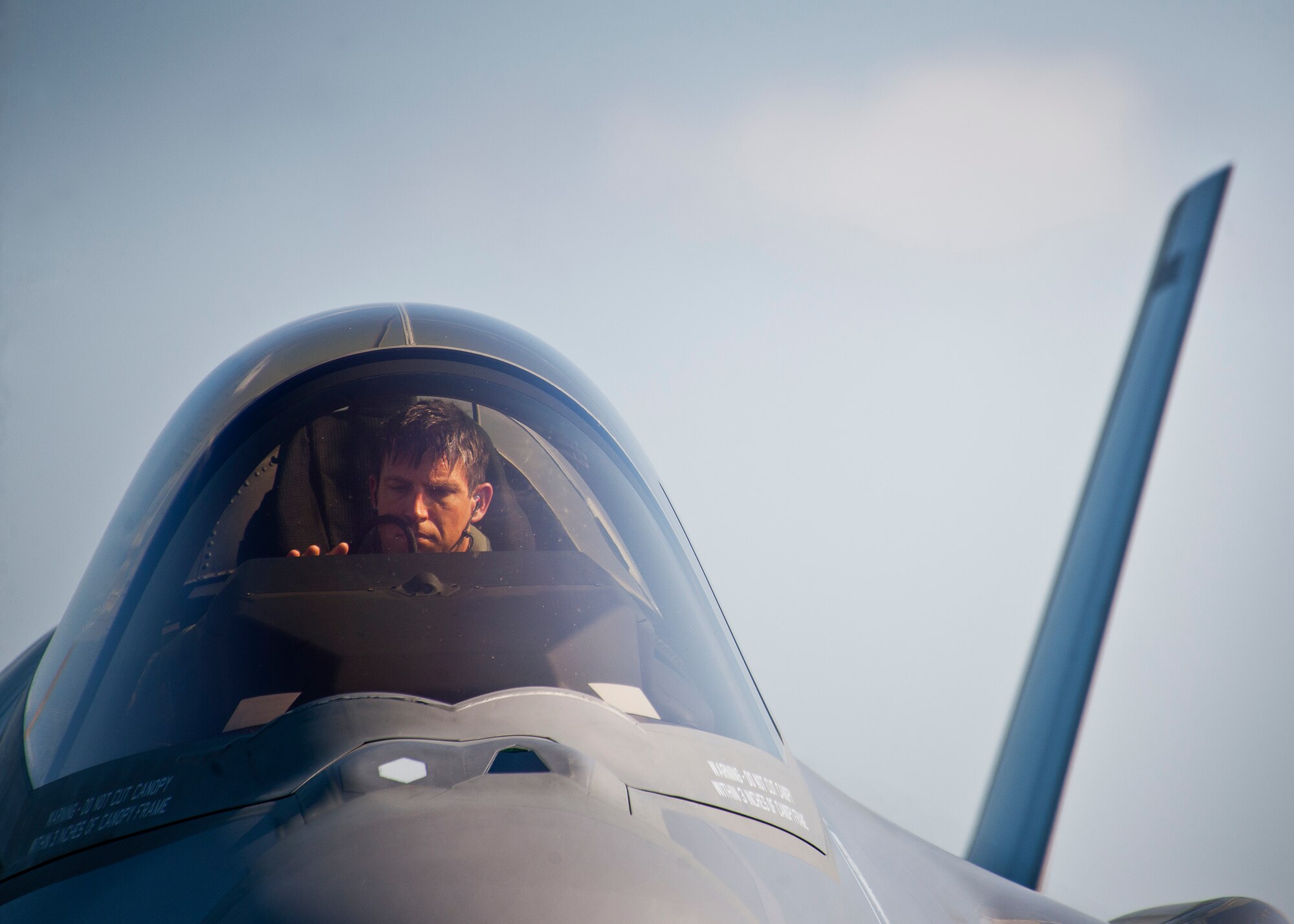 Capt. Elijah Supper, an F-35A Lightning II pilot with the 58th Fighter Squadron, powers down his aircraft after landing at Duke Field Aug. 6.  The joint strike fighter landed at Duke for the first time moments later to participate in a joint base exercise.  (U.S. Air Force photo/Tech. Sgt. Sam King)