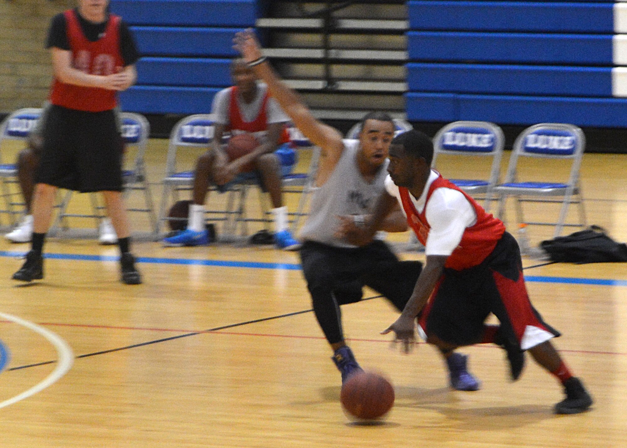 Koraye Williams, 56th Comptroller Squadron, drives down the court during a playoff intramural basketball game against 56th Medical Group at Luke Air Force Base. MDG won 42-30. (U.S. Air Force photo/Senior Airman Devante Williams)