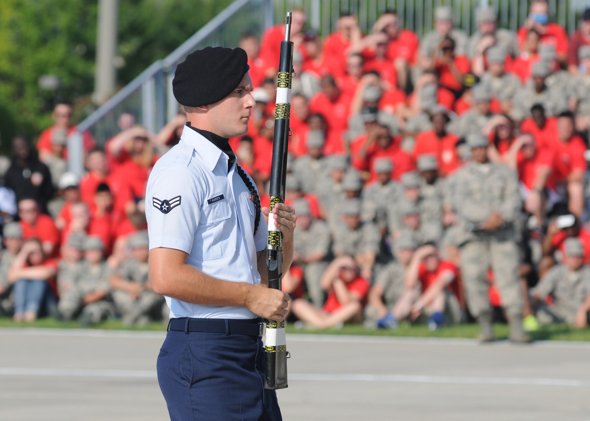 Airman 1st Class Michael Warden, 338th Training Squadron freestyle drill master, prepares to exit the field of freestyle drill competition during the 81st Training Group’s drill down competition Aug. 15, 2014, behind the Levitow Training Support Facility at Keesler Air Force Base, Miss.  The 338th TRS “Dark Knights” placed first in open ranks, freestyle and overall.  (U.S. Air Force photo by Kemberly Groue)