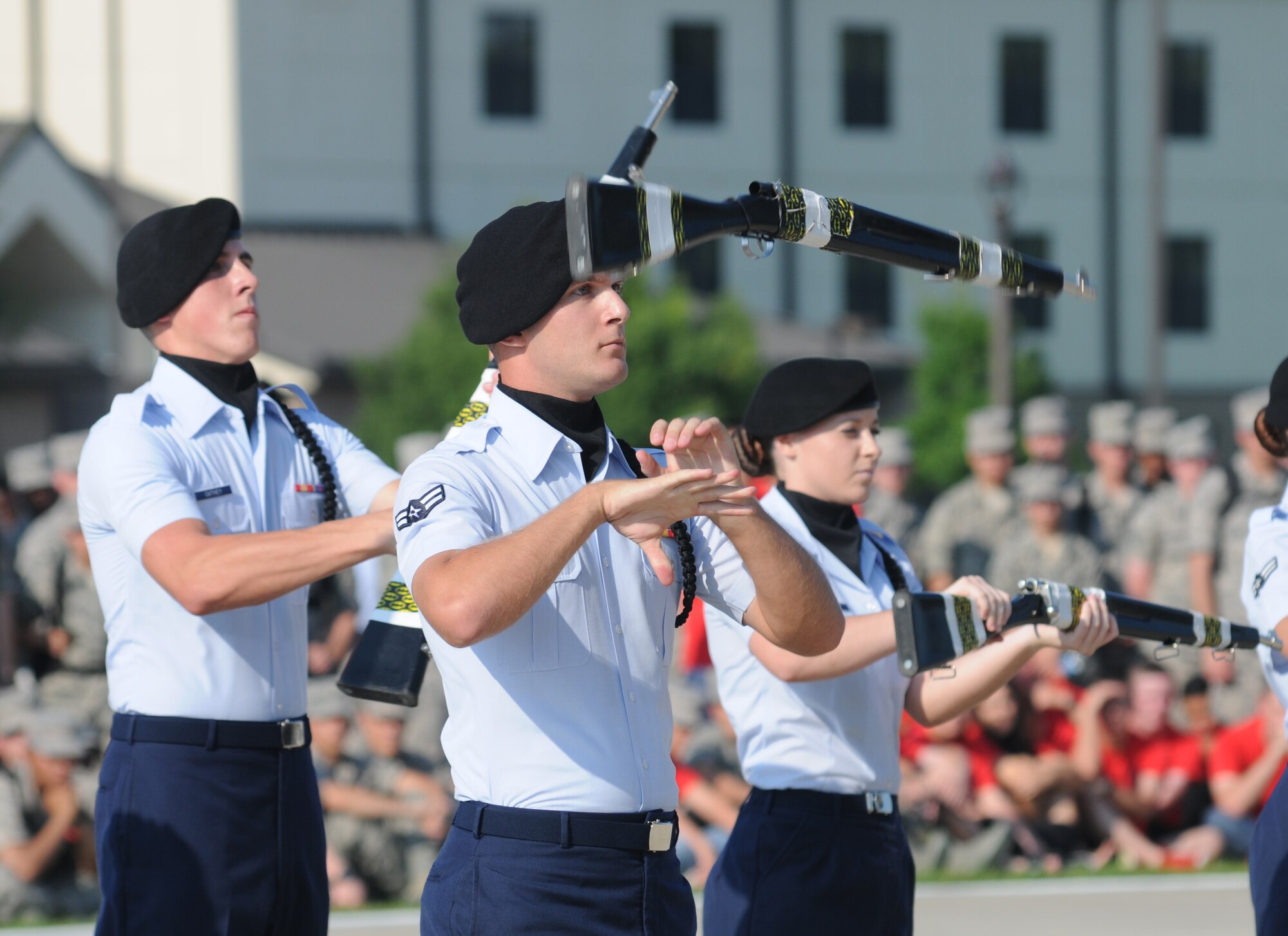 Airman 1st Class Michael Warden, 338th Training Squadron freestyle drill master, spins a rifle during the 81st Training Group’s drill down competition Aug. 15, 2014, behind the Levitow Training Support Facility at Keesler Air Force Base, Miss.  The 338th TRS “Dark Knights” placed first in open ranks, freestyle and overall.  (U.S. Air Force photo by Kemberly Groue)