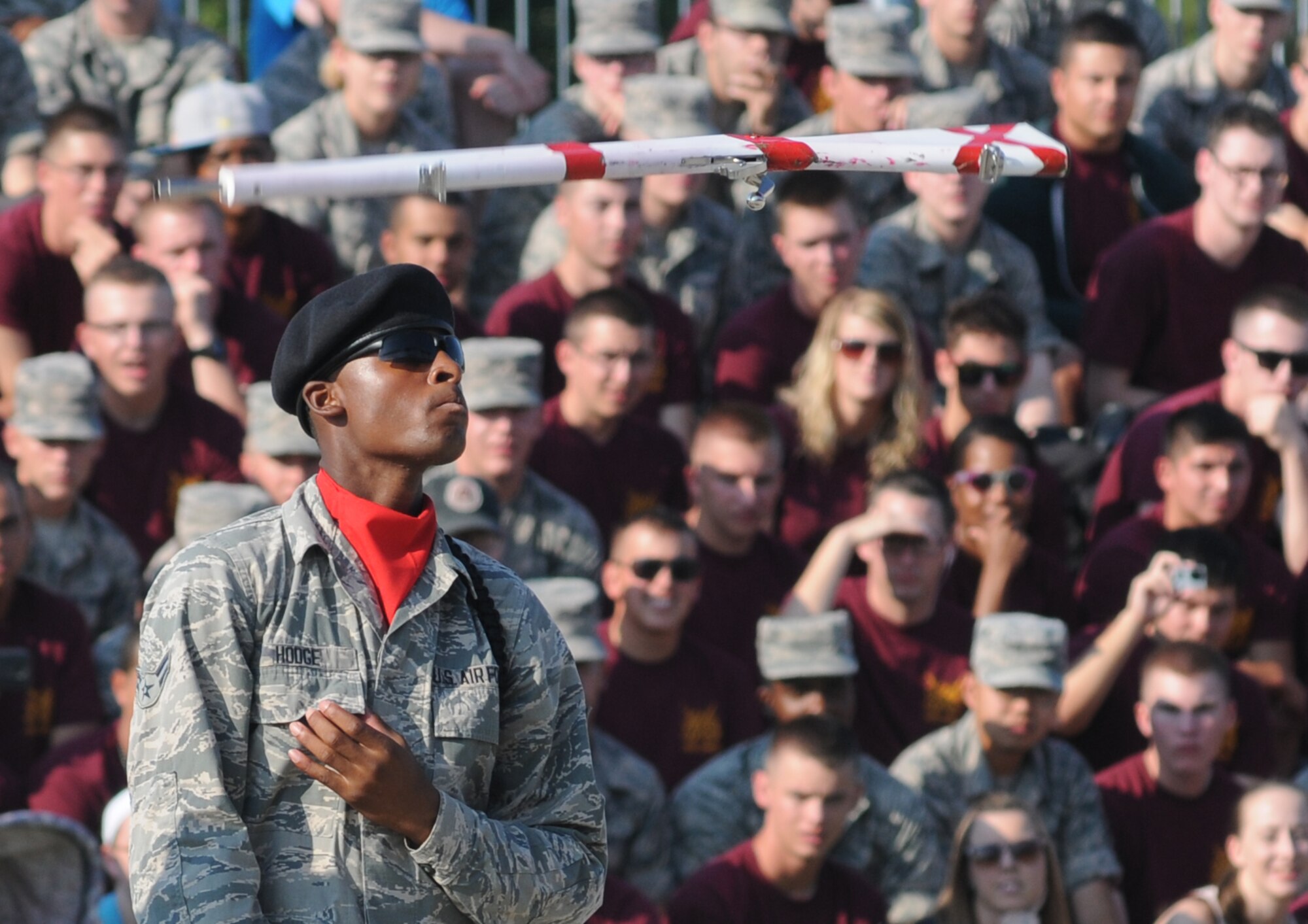 Airman 1st Class Tyleal Hodge, 336th Training Squadron, spins his rifle in the air during the 81st Training Group’s drill down competition Aug. 15, 2014, behind the Levitow Training Support Facility at Keesler Air Force Base, Miss.  The 336th TRS “Red Wolves” placed 2nd in freestyle and overall.  (U.S. Air Force photo by Kemberly Groue)