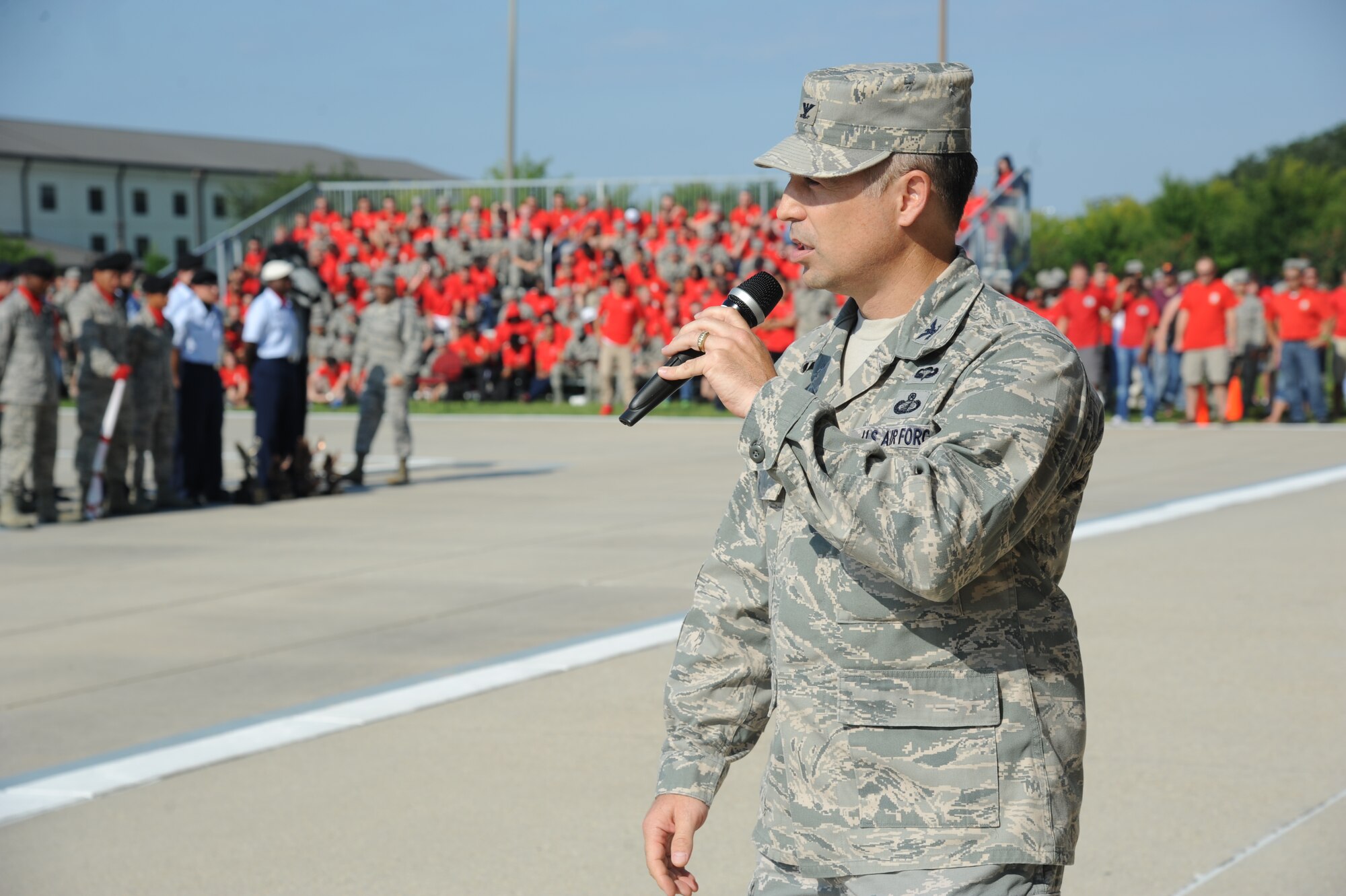 Col. George Tombe, 81st Training Group commander, and Maj. Jonathon Mueller, 81st Training Wing, watch performers from the staging area during the 81st Training Group’s drill down competition Aug. 15, 2014, behind the Levitow Training Support Facility at Keesler Air Force Base, Miss.  Mueller served as the presiding officer for the event.  (U.S. Air Force photo by Kemberly Groue)