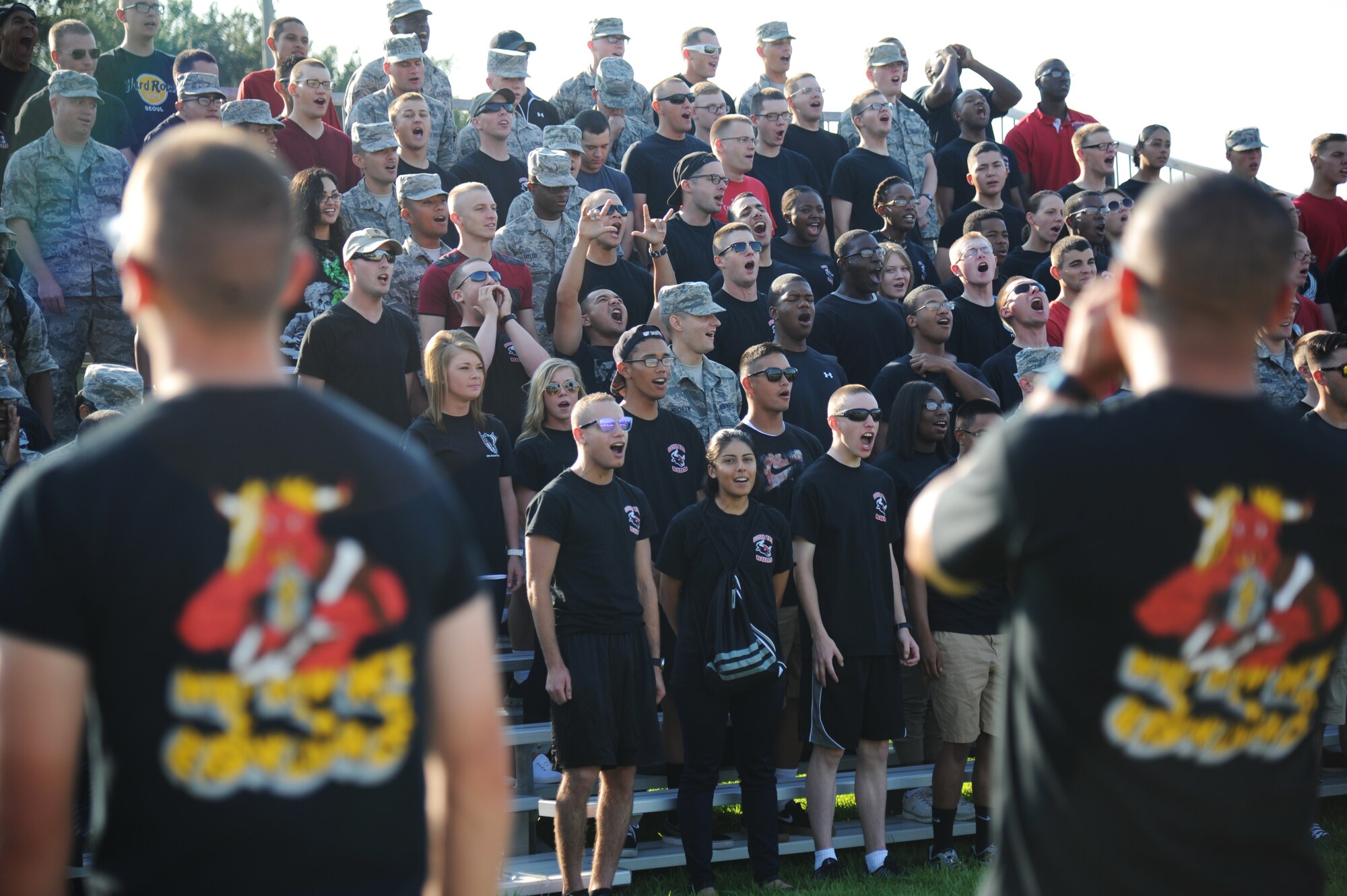 Airmen from the 335th Training Squadron yell their squadron chant during the 81st Training Group’s drill down competition Aug. 15, 2014, behind the Levitow Training Support Facility at Keesler Air Force Base, Miss.  The 335th TRS “Bulls” placed third overall.  (U.S. Air Force photo by Kemberly Groue)