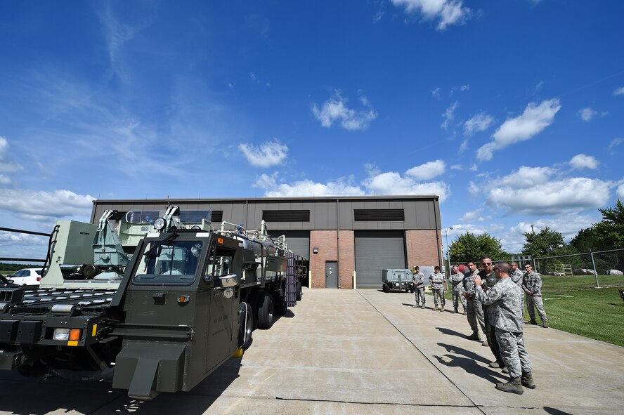 Senior Master Sgt. Phil Aliberti, aerial spray maintenance flight chief, discusses the 910th’s Modular Aerial Spray System (MASS) with Maj. Gen. Scott M. Hanson, Director of Operations, Headquarters Air Mobility Command, Scott Air Force Base, Illinois, Aug. 15. Hanson visited YARS to become more familiar with the 910th Airlift Wing’s special aerial spray mission and see how Air Mobility Command can help the 910th and Air Force Reserve Command with their roles in bringing this mission to the Department of Defense. U.S. Air Force photo/Eric M. White.