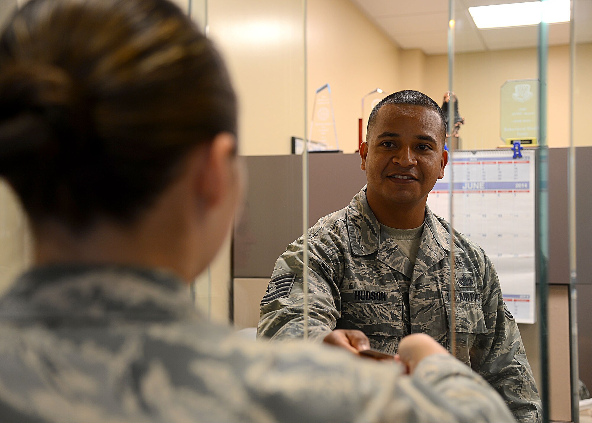Tech. Sgt. Toyre Hudson, 6 Medical Operations Squadron mental health flight chief, assists a patient at MacDill Air Force Base, Fla. Hudson has been named one of the 12 Outstanding Airman of the Year for 2014.  (U.S. Air Force photo by Staff Sgt. Brittany Liddon/Released)