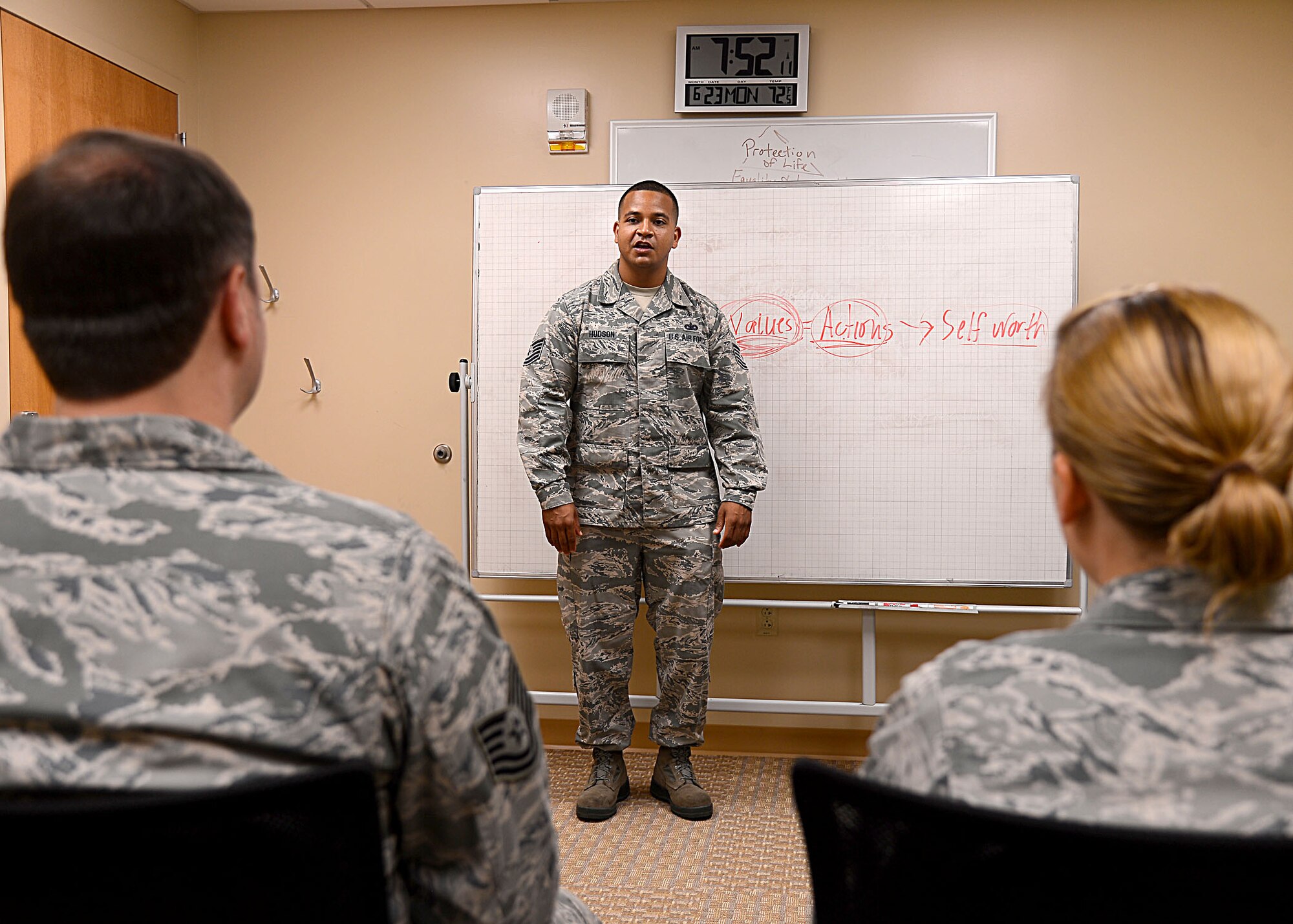 Tech. Sgt. Toyre Hudson, 6 Medical Operations Squadron mental health flight chief, speaks to Airmen at MacDill Air Force Base Fla. Hudson has been named one of the 12 Outstanding Airman of the Year for 2014. (U.S. Air Force photo by Staff Sgt. Brittany Liddon/Released)