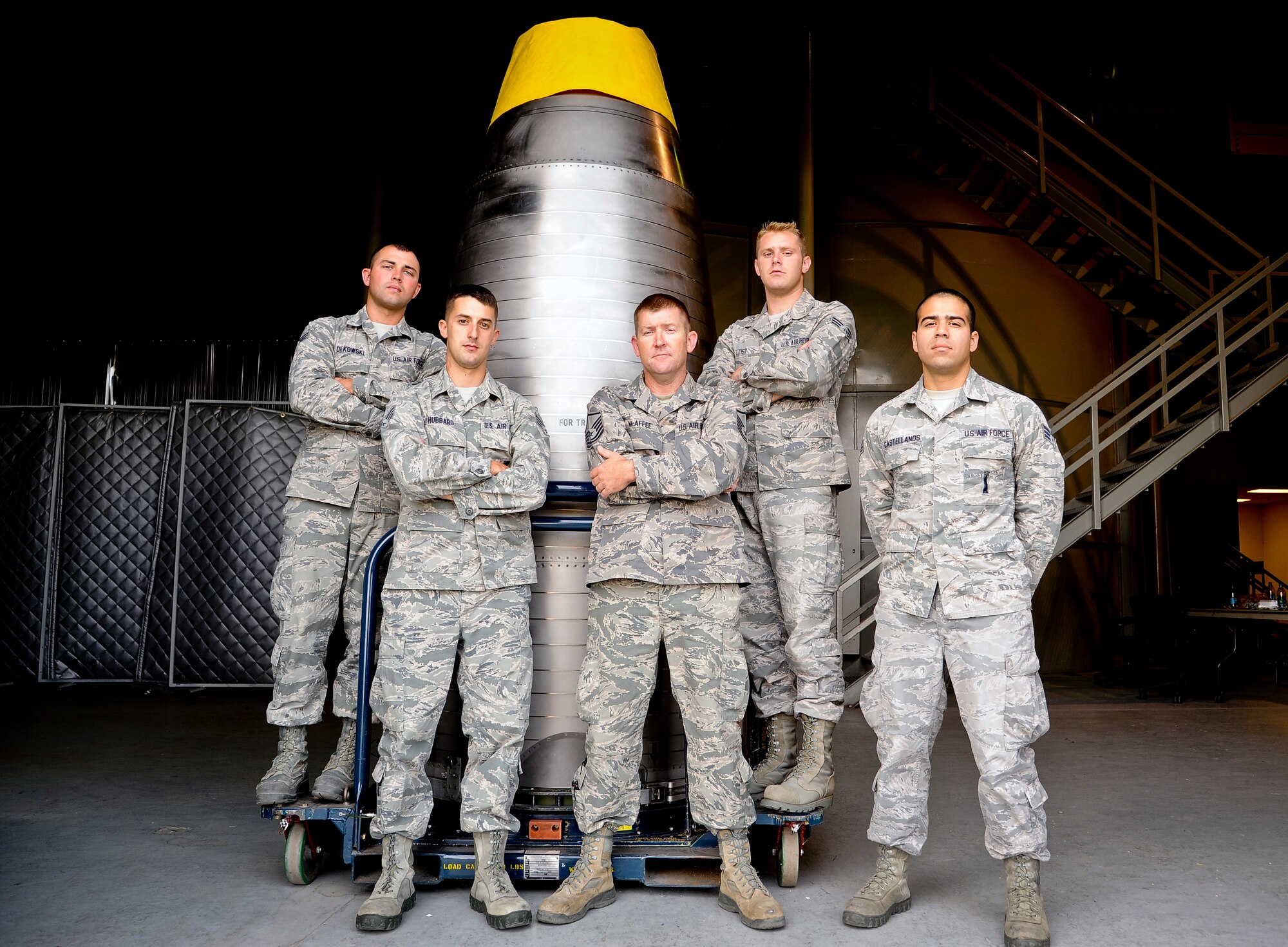 Team Malmstrom’s missile maintenance team poses for a photograph after a training session at the T-31 trainer building Aug. 12. The team is one of nine from Malmstrom Air Force Base that will be competing in the Air Force Global Strike Challenge. (U.S. Air Force photo/Airman 1st Class Collin Schmidt) 