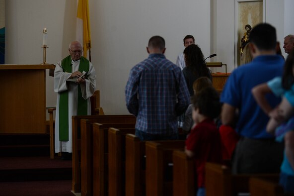 Airmen and families from the 52nd Fighter Wing community attend a religious service in the chapel at Spangdahlem Air Base, Germany, Aug. 17, 2014. The chapel offers many different religious services to help people exercise spiritual fitness. (U.S. Air Force photo by Airman 1st Class Kyle Gese/Released)