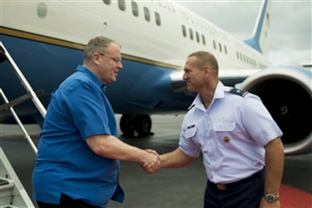 Deputy Defense Secretary Bob Work, left, speaks with Air Force Brig. Gen. Dirk D. Smith, deputy director of operations for U.S. Pacific Command, as he arrives on Joint Base Pearl Harbor-Hickam, Hawaii, Aug. 17, 2014. 