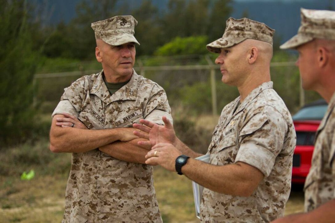 LtCol Charles Berry with the Marine Corps Warfighting Laboratory talks to MGen Richard Simcock, deputy commander Marine Forces Pacific, about the Warfighting Lab's Advanced Warfighting Experiment conducted during RIMPAC 2014 in Hawaii.
