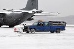 Civilian Tom McBurney, a state employee in operations and maintenance at Yeager Airbase, Charleston, W.Va., works to remove snow, Jan. 5, 2010. State employees worked extended hours to remove snow and keep 130th Airlift Wing of the West Virginia Air National Guard operations up and running. Snow and emergency service started December 2010 and operations and maintenance has accrued nearly 300 hours of overtime.