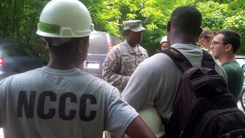 Col. Anthony Mitchell, commander of U.S. Army Corps of Engineers St. Louis District, meets the AmeriCorps Maple 1 team during a work day on Chief Illini Trail at Lake Shelbyville.