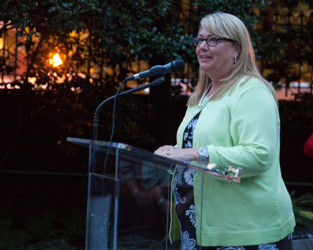 Karen Guenther, the CEO, president, and founder of Injured Marine Semper Fi Fund and parade guest of honor, addresses the guests at the Evening Parade reception at the Home of the Commandants in Washington D.C., on Aug. 15. 2014. (U.S. Marine Corps photo by Lance Cpl. Samantha K. Draughon/ Released)