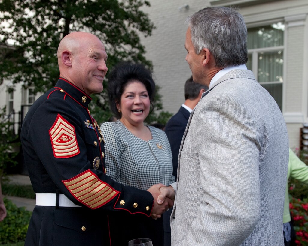 Sgt. Maj. Micheal P. Barrett, the 17th Sergeant Major of the Marine Corps, greets guests at the Evening Parade reception at the Home of the Commandants in Washington D.C., on Aug. 15. 2014. (U.S. Marine Corps photo by Lance Cpl. Samantha K. Draughon/ Released)